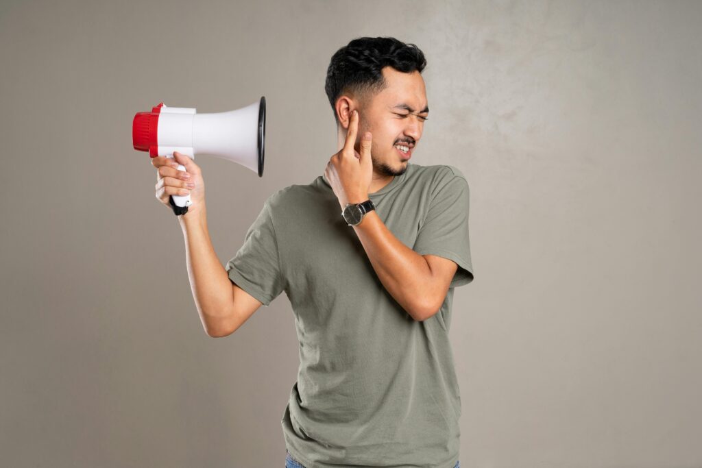 Person trying to quiet noise. 